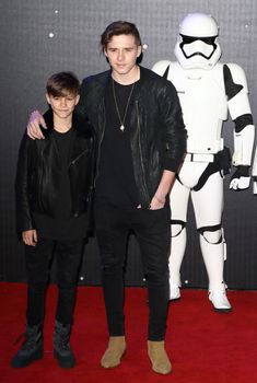 UNITED-KINGDOM, London : Brooklyn Beckham and Romeo Beckham, both children of football star David Beckham and fashion celebrity Victoria Beckham, pose for photographers while Star Wars cast, crew and celebrities hit the red carpet for the last episode The Force Awakens European Premiere on December 16, 2015 in central London.   	