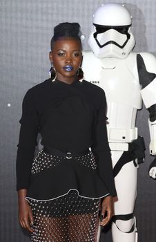 UNITED-KINGDOM, London : Star Wars actress Lupita Nyong'o poses for photographers while Star Wars cast, crew and celebrities hit the red carpet for the last episode The Force Awakens European Premiere on December 16, 2015 in central London.   	