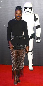 UNITED-KINGDOM, London : Star Wars actress Lupita Nyong'o poses for photographers while Star Wars cast, crew and celebrities hit the red carpet for the last episode The Force Awakens European Premiere on December 16, 2015 in central London.     	