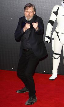 UNITED-KINGDOM, London : American Actor Mark Hamill, who plays Luke Skywalker, poses for photographers while Star Wars cast, crew and celebrities hit the red carpet for the last episode The Force Awakens European Premiere on December 16, 2015 in central London.     	