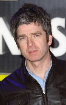 UNITED-KINGDOM, London : English musician, singer, guitarist, and songwriter Noel Gallagher poses for photographers while Star Wars cast, crew and celebrities hit the red carpet for the last episode The Force Awakens European Premiere on December 16, 2015 in central London.   	