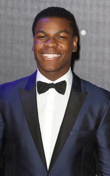 UNITED-KINGDOM, London : One of the leading actor in the new episode of Star Wars John Boyega poses for photographers while Star Wars cast, crew and celebrities hit the red carpet for the last episode The Force Awakens European Premiere on December 16, 2015 in central London.   	