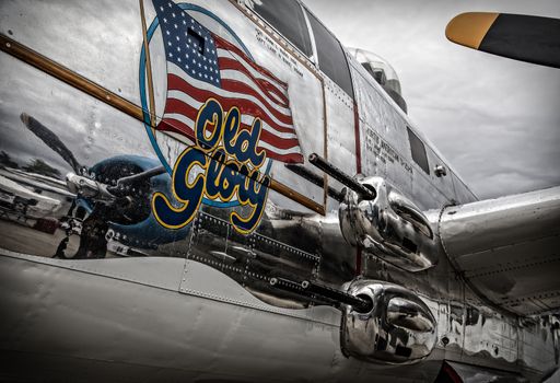 Redding, California, USA- September 28, 2014: A WWII era b-25 Mitchell bomber sits on display at an airshow in northern California and showcases it's 50 calibre machine guns and highly polished skin.