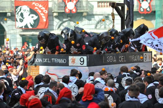 ITALY, Ivrea: People hit each other with oranges during the battle of oranges in Ivrea, Italy on February 8, 2016.This unique event sees people re-enact a middle age battle using oranges. Thousands gathered in the town to pelt each other with the fruit, which is imported from Sicily. 