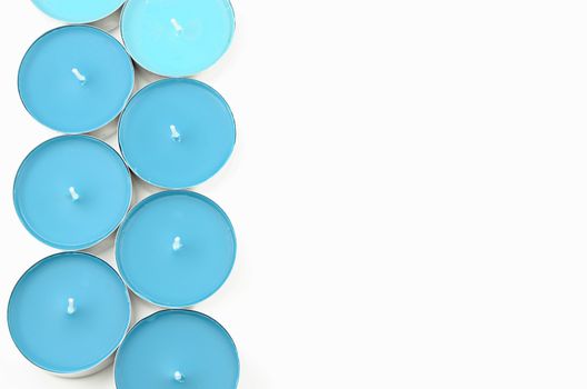 Blue Tea Lights for Relaxation on white background
