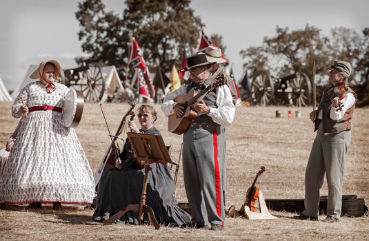 A band dressed as Civil War era musicians play during a break in the action at a Civil War reenactment in Anderson, California.
Photo taken on: September 27th, 2014