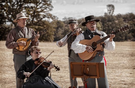 A band dressed as Civil War era musicians play during a break in the action at a Civil War reenactment in Anderson, California.
Photo taken on: September 27th, 2014