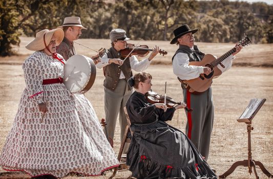 A band dressed as Civil War era musicians play during a break in the action at a Civil War reenactment in Anderson, California.
Photo taken on: September 27th, 2014