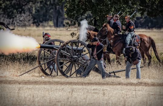 Northern Army artillery fires at the Confederates during Civil War Reenactment at Anderson, California.
Photo taken on: September 27th, 2014