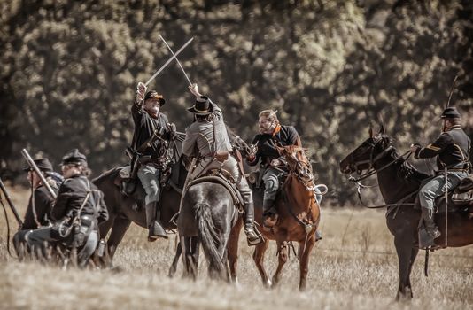 Northern Army scouts fight on horseback with the Confederates during Civil War Reenactment at Anderson, California.
Photo taken on: September 27th, 2014