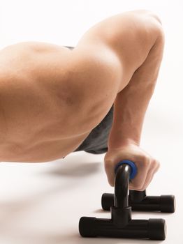 Strong model man doing push up exercises