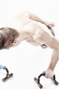 Strong model man doing push up exercises