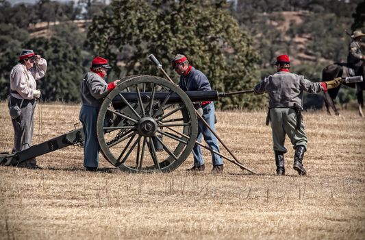 Confederate troops prepare to fire their cannon during a Civil War reenactment in Anderson, California.
Photo taken on: September 27th, 2014