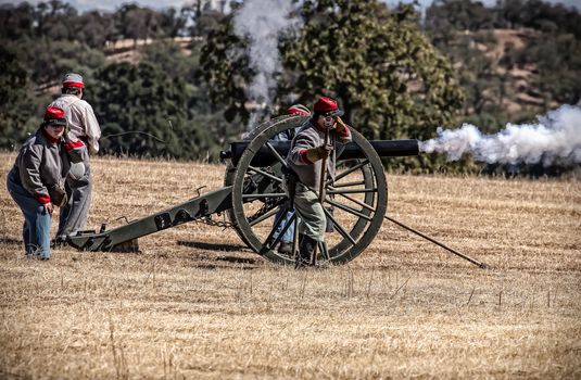 Confederate troops fire their cannon during a Civil War reenactment in Anderson, California.
Photo taken on: September 27th, 2014