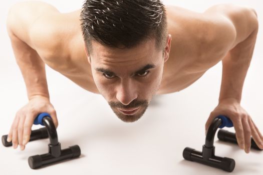 Strong model man doing push up exercises