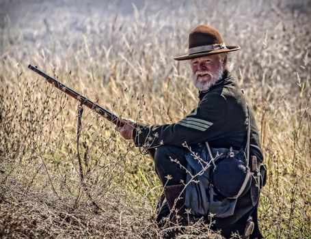 Union sharpshooter looks for targets during a Civil War reenactment in Anderson, California.
Photo taken on: September 27th, 2014