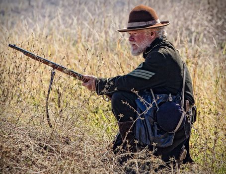 Union sharpshooter looks for targets during a Civil War reenactment in Anderson, California.
Photo taken on: September 27th, 2014