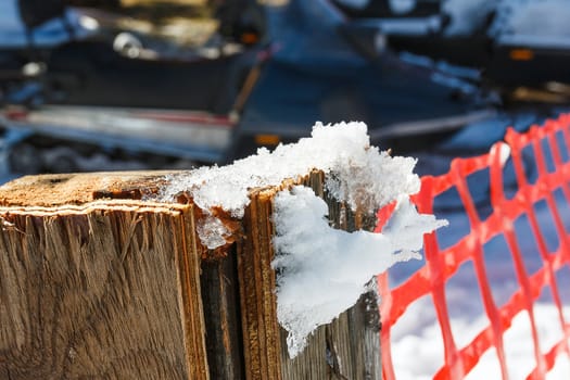 Snow hang on wood pole.