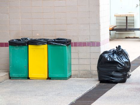 empty bins and black garbage bags