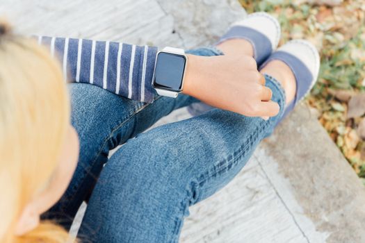 hipster woman looking smart watch new technology