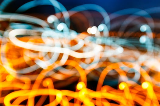 Abstract blur light trail in orange and blue color.