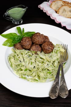 Meatballs with pasta sauce avocado,  parmesan and basil