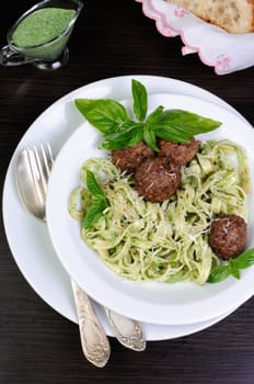 Meatballs with pasta sauce avocado,  parmesan and basil