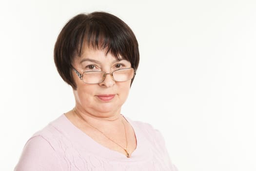 the beautiful mature woman with a severe look wearing spectacles