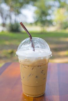 Cold milk coffee and ice in glass