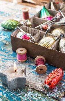 various outdated Christmas toys in a cardboard box