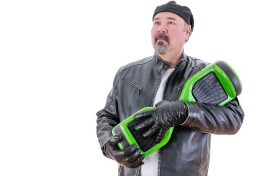 Serious bearded middle aged overweight single man in leather coat and gloves holding his green and black hoverboardver white background
