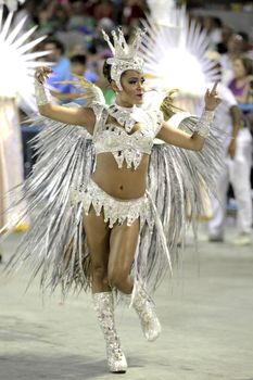 BRAZIL, Rio de Janeiro: A performer dances during Sao Clemente samba school performance at the Rio Carnival in Sambodromo on February 8, 2016 in Rio de Janeiro, Brazil. Thousands of tourists gathered in Rio de Janeiro for the carnival.  	