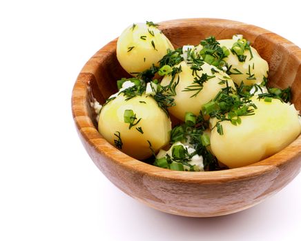 Boiled Potato with Greens and Butter in Wooden Bowl Cross Section on white background