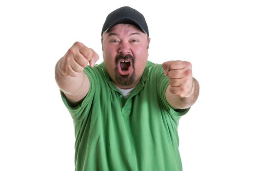 Waist Up of Excited Man Wearing Green Shirt and Baseball Cap Pumping Fists Toward Camera While Celebrating Team Win in Studio with White Background