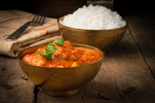 Authentic Indian butter chicken served with white rice.