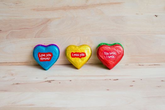 Chocolate wrapper  on Valentine's Day,Wood background