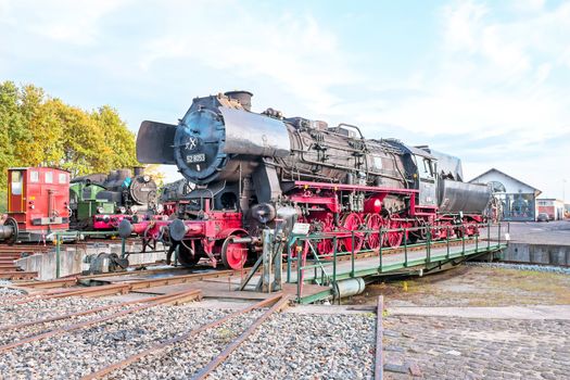 Antique steam locomotive in depot