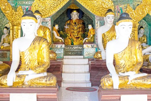 Buddha statues inside the  Shwedagon Pagoda in Myanmar
