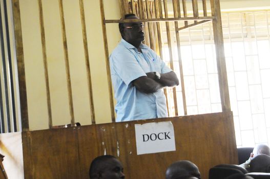 UGANDA, Kampala: David Sejusa waits for his case to be heard at military court in Kampala, Uganda on February 9, 2016. He would then be denied bail and have his case adjourned until February 23. Sejusa was jailed after being charged the week previous with charges including absence without official leave, participating in partisan political activities, and insubordination.