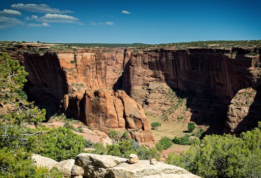 Rugged canyons, steep cliffs, colorful rocks, ancient native American trails and dwellings can all be found in Canyon de Chelly National Monument in Arizona.