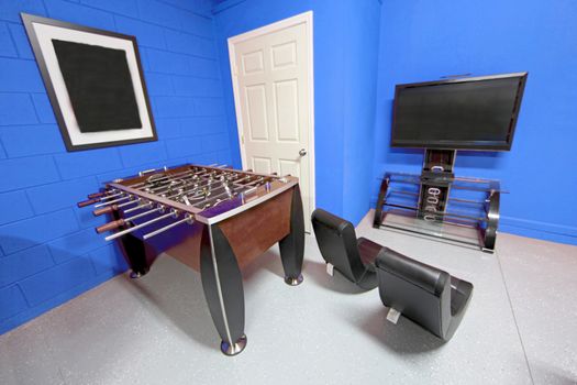 A Games Room with Foosball, TV and Gaming Chairs