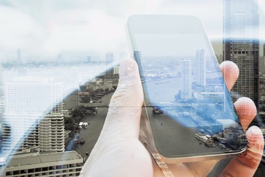 Double exposure of man using smart phone and cityscape background, urban lifestyle and Business technology concept.