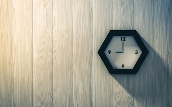 Black clock hanging on the wood wall , abstract background