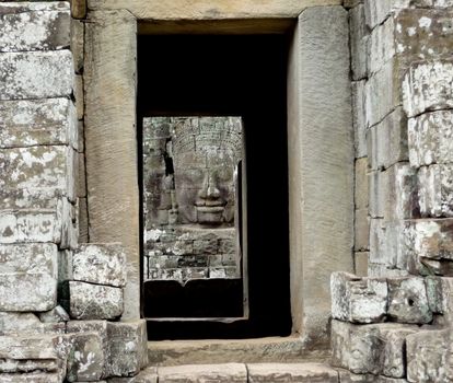 Face Tower of Bayon Temple Framed by a doorway