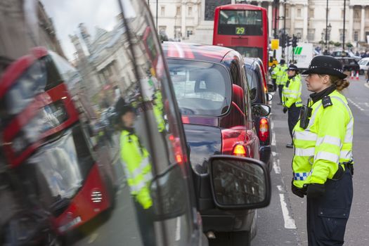 UNITED-KINGDOM, London: Dozens of black cab drivers stage a protest in central London, causing gridlock to Whitehall and Trafalgar Square as taxi drivers hold another protest under the hashtag #Blackcabprotest against competition from app-based taxi services, and especially US company Uber, on February 10, 2016. Since its introduction in Britain, drivers of the city's famous black cabs have argued Uber bypasses local licensing and safety laws and amounts to unfair competition. They have staged a number of high-profile protests, including go-slow demonstrations that have brought traffic in the centre of London from Trafalgar Square to Victoria street.