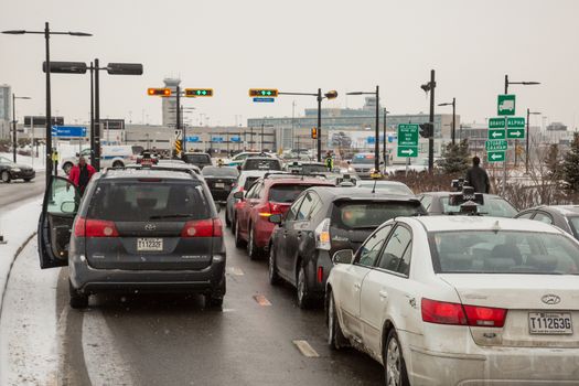 CANADA, Montreal: Taxi's line up and park outside of Trudeau Airport in Montreal, on February 10, 2016, in a show of protest against Uber.Traffic was disrupted at the airport as the taxi drivers hope to force Quebec's government to make a change.