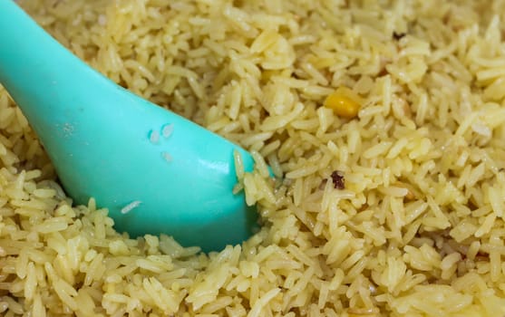 Close up of Yellow rice with spoon