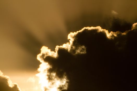 Cloud Close up with rays of sun light from behind. Sunset