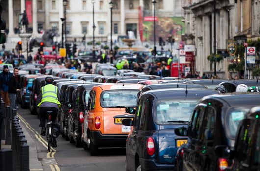 UNITED-KINGDOM, London: Dozens of black cab drivers stage a protest in central London, causing gridlock to Whitehall and Trafalgar Square as taxi drivers hold another protest under the hashtag #Blackcabprotest against competition from app-based taxi services, and especially US company Uber, on February 10, 2016. Since its introduction in Britain, drivers of the city's famous black cabs have argued Uber bypasses local licensing and safety laws and amounts to unfair competition. They have staged a number of high-profile protests, including go-slow demonstrations that have brought traffic in the centre of London from Trafalgar Square to Victoria street.