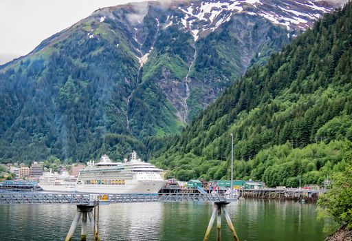 Juneau, Alaska, USA- June 17, 2012: A cruise ship is docked and unloading passengers at the terminal in the state capital of Alaska.